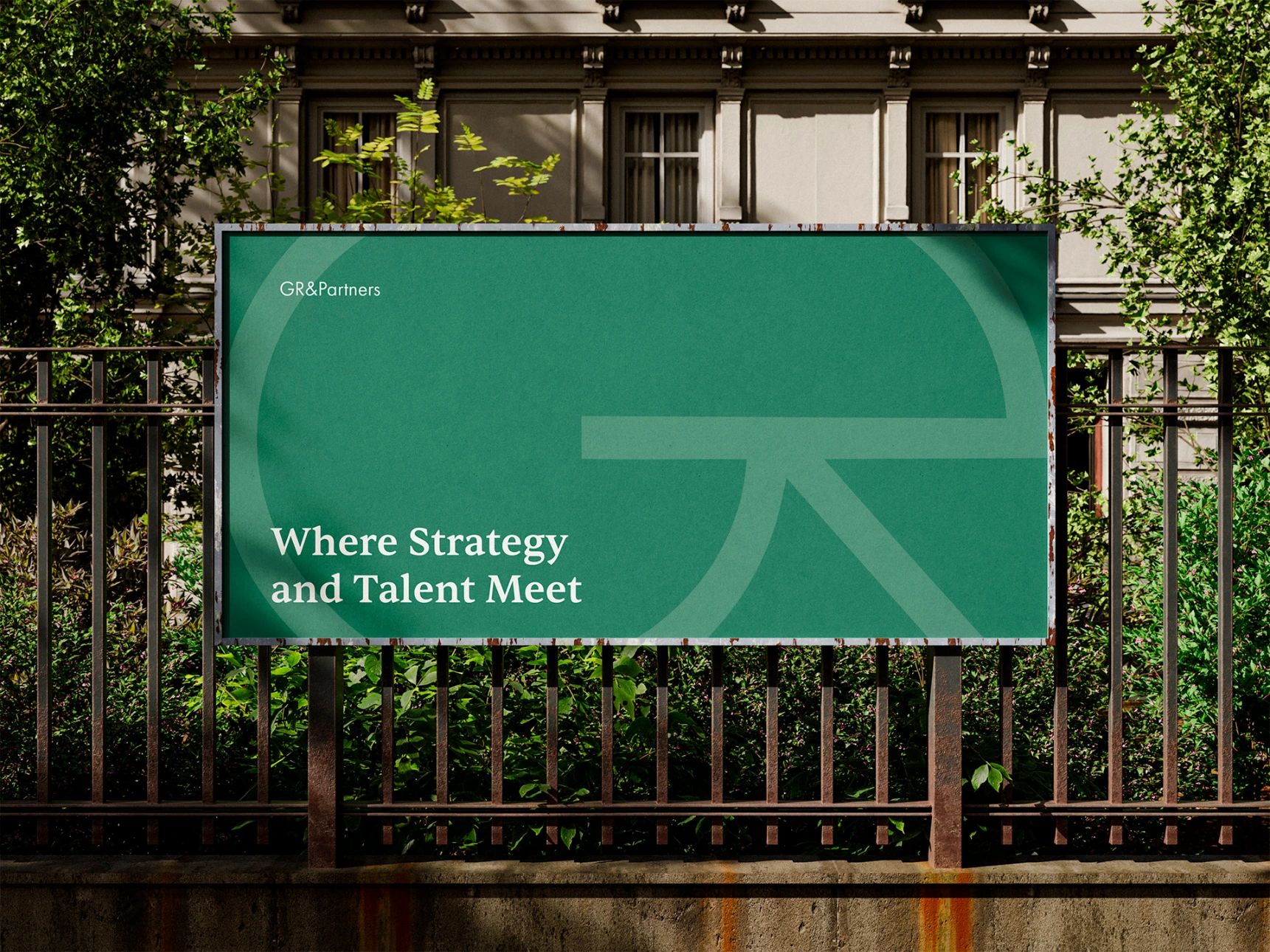 Advertisement for an HR firm displayed on a fence.